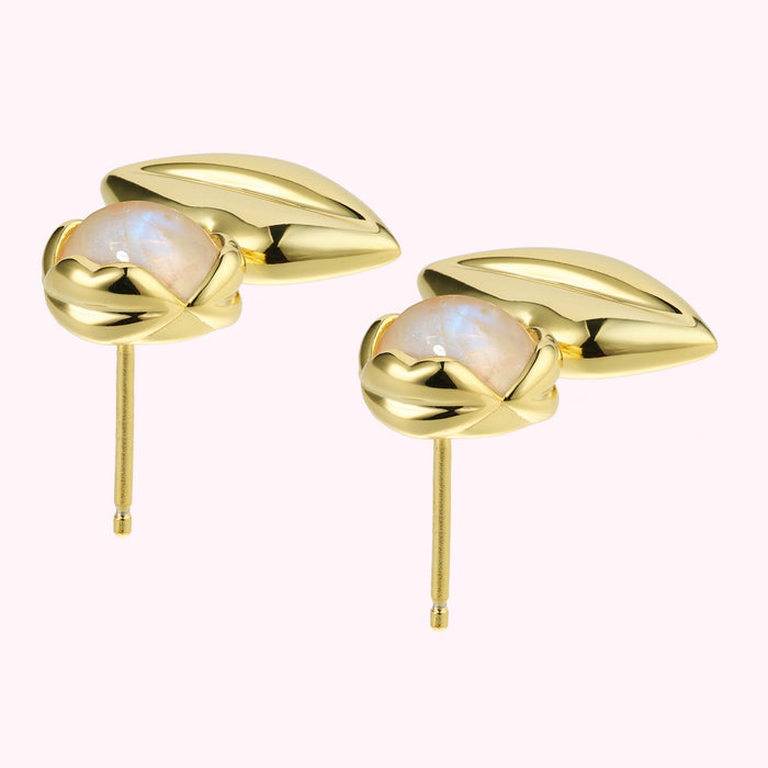 Pair of gold stud earrings with moonstone accents.