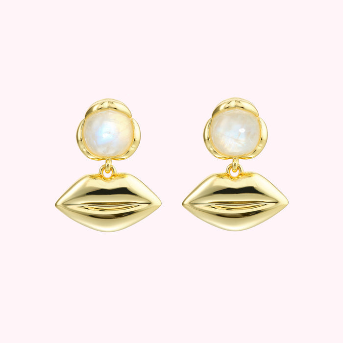 Gold lip earrings with moonstone accents.