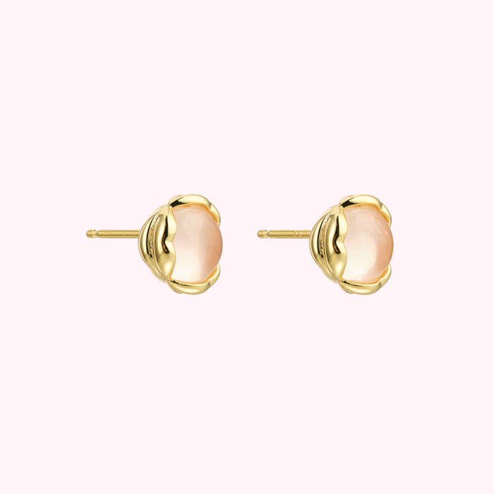 Pair of gold stud earrings with pale pink stones.
