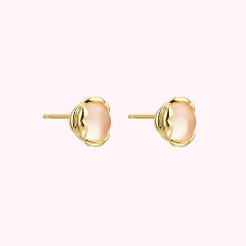 Pair of gold stud earrings with pale pink stones.