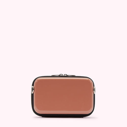 A dusty rose rectangular crossbody bag with black trim and silver hardware against a white background.