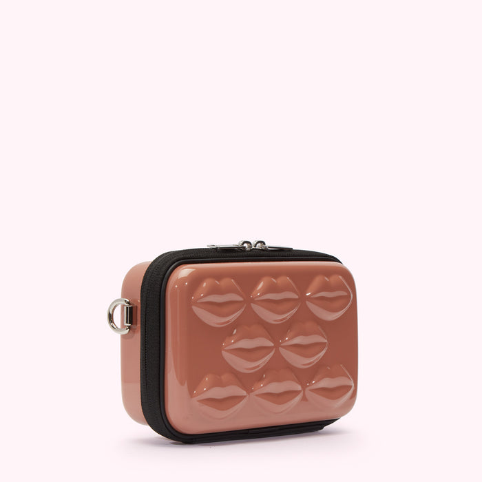 Dusty rose pink crossbody bag with moulded lips on the front.