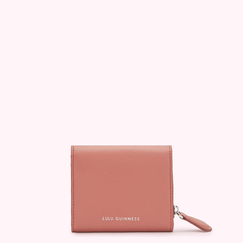 Dusty rose Lulu Guinness zip-around wallet against a white background.