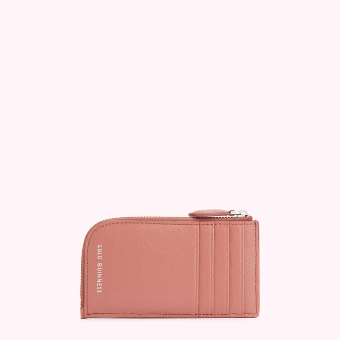 Dusty rose Lulu Guinness zip-around cardholder against a white background.