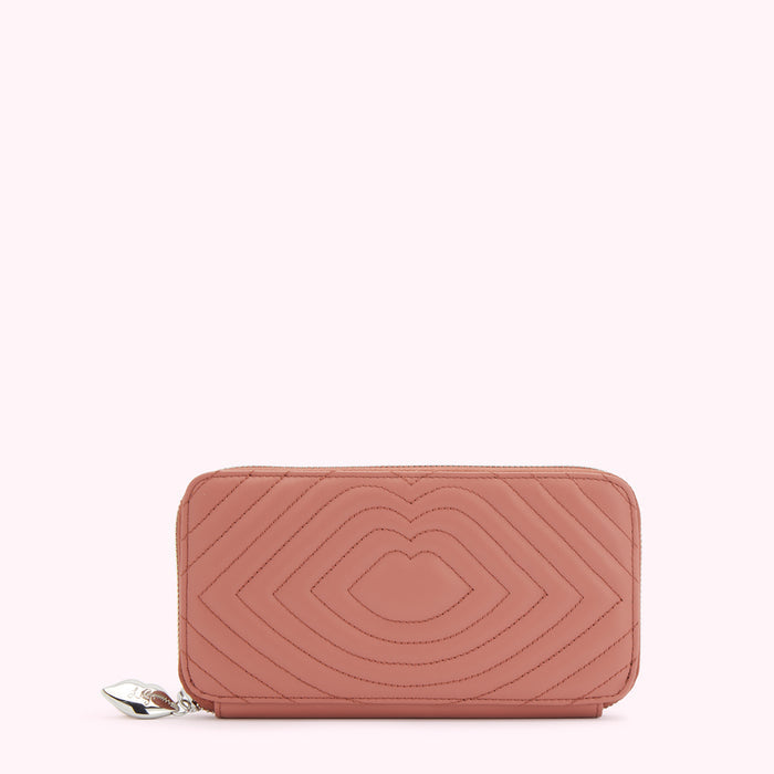 Dusty rose quilted leather zip-around wallet with a lip design.