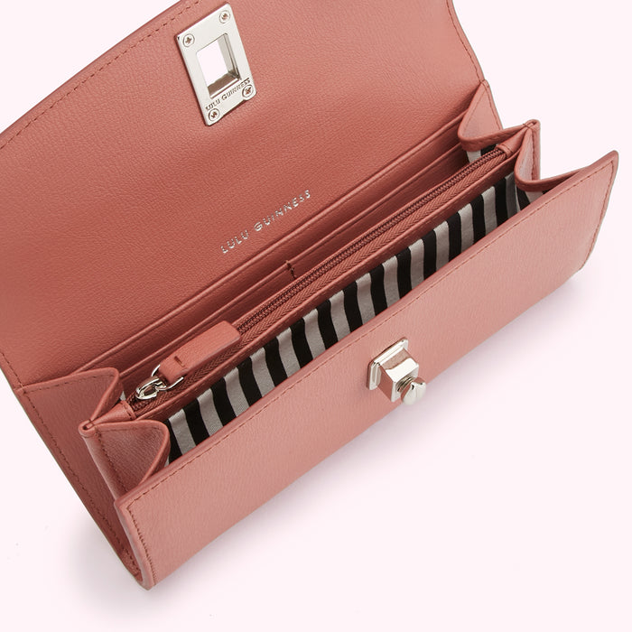 Open dusty rose Lulu Guinness wallet with black and white striped interior.