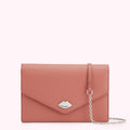 Dusty rose leather clutch with silver lip-shaped clasp and detachable chain strap.
