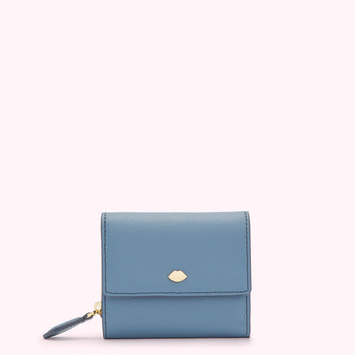 A small, light blue leather wallet with a gold lip-shaped logo.