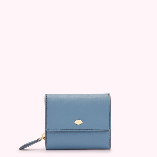 A small, light blue leather wallet with a gold lip-shaped logo.