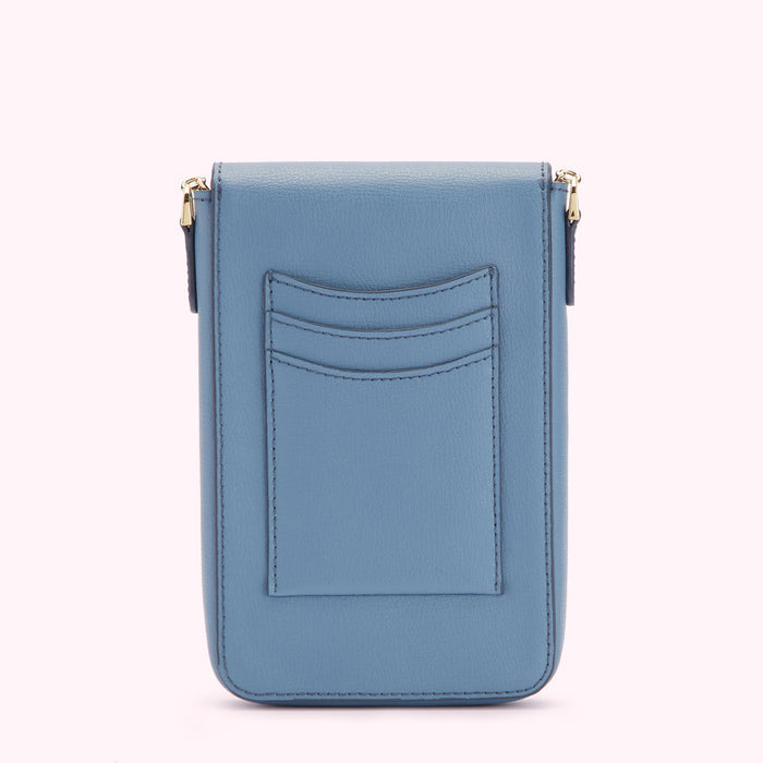 Dust blue leather crossbody bag with back pocket detail.