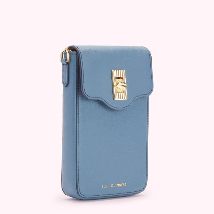 A powder blue Lulu Guinness crossbody phone bag with gold clasp.
