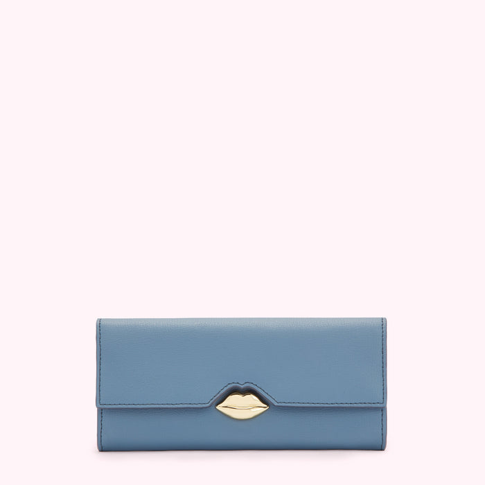 Dusty blue leather wallet with gold lip-shaped clasp against a white background.