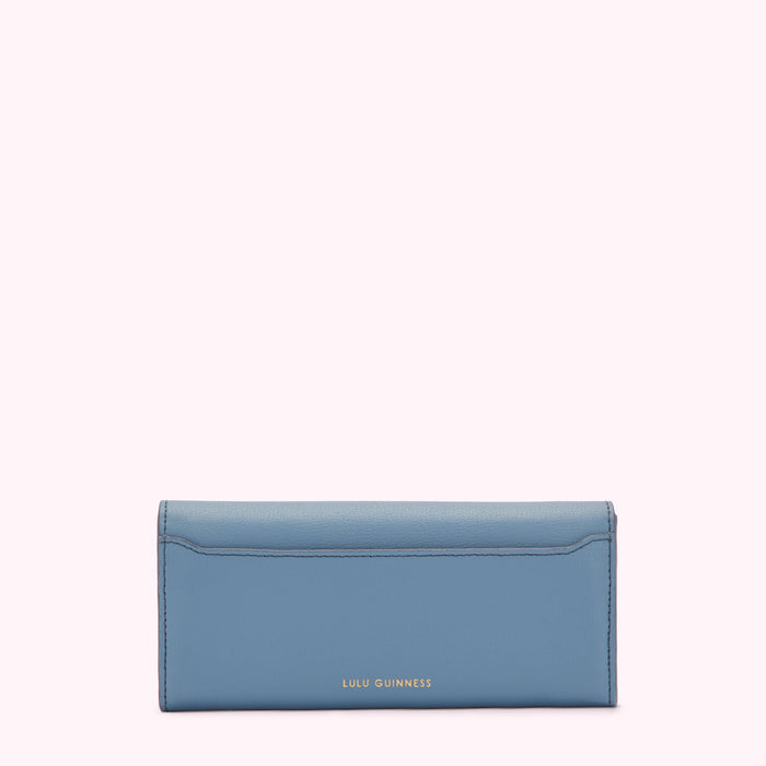 A powder blue leather wallet by Lulu Guinness, shown from the back.