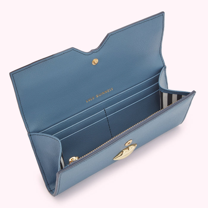 Open blue leather Lulu Guinness wallet with gold lip clasp.