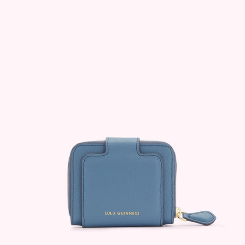 A small, blue leather Lulu Guinness wallet on a white background.