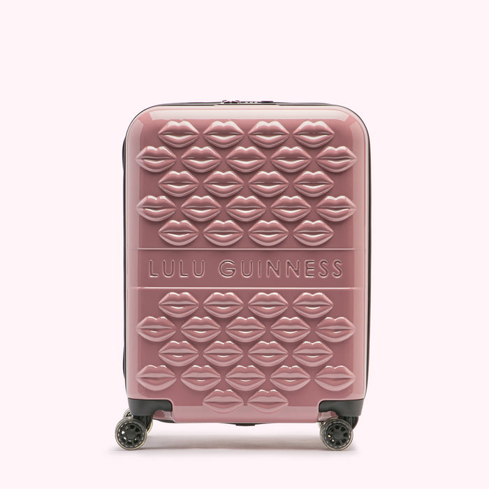 Pink Lulu Guinness suitcase with a lip design.