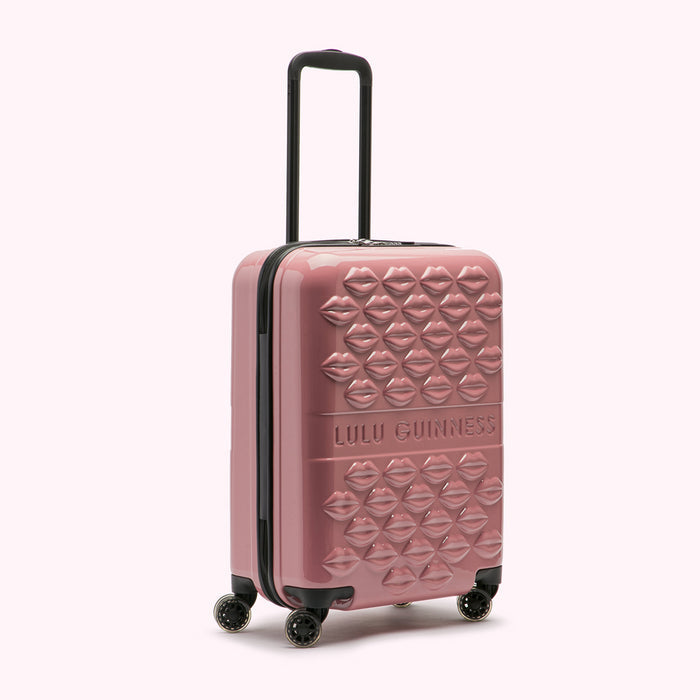 Pink Lulu Guinness suitcase with lips pattern.