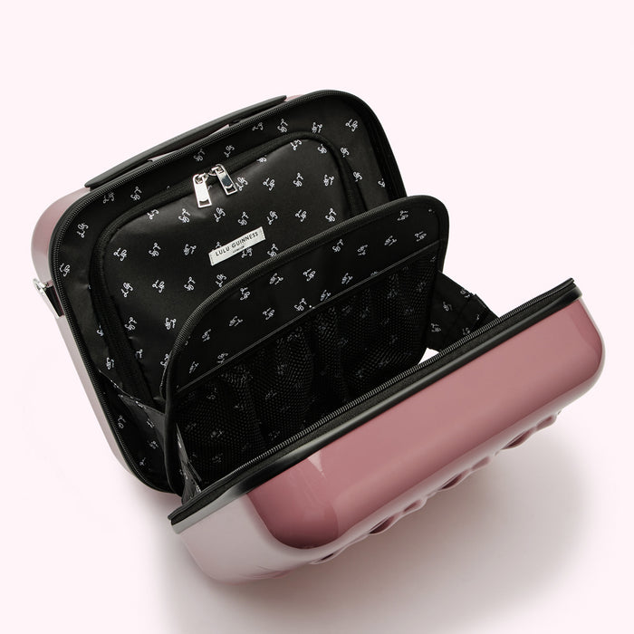 Open mauve Lulu Guinness carry-on suitcase with black interior compartments and zippered pouches.