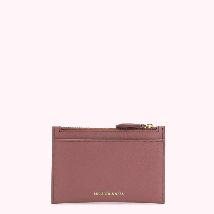 A dusty rose Lulu Guinness zip-around cardholder against a white background.