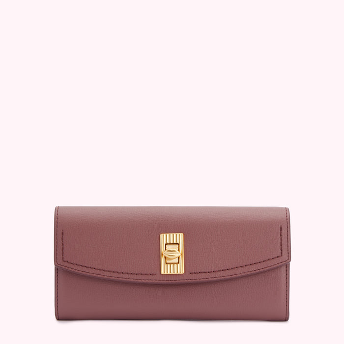 Dusty rose leather wallet with gold clasp.
