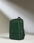 a green backpack with a black strap