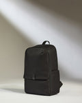 a black backpack with a strap