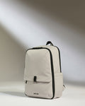 a white backpack with black straps