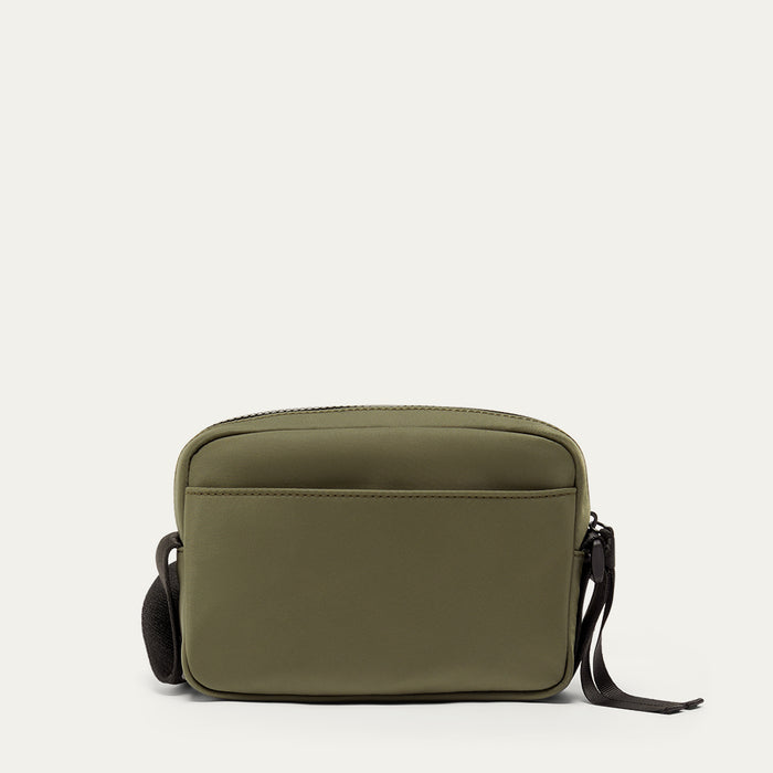 Green nylon crossbody bag on a white background