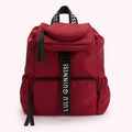 Red Lulu Guinness backpack with black straps and zipper.