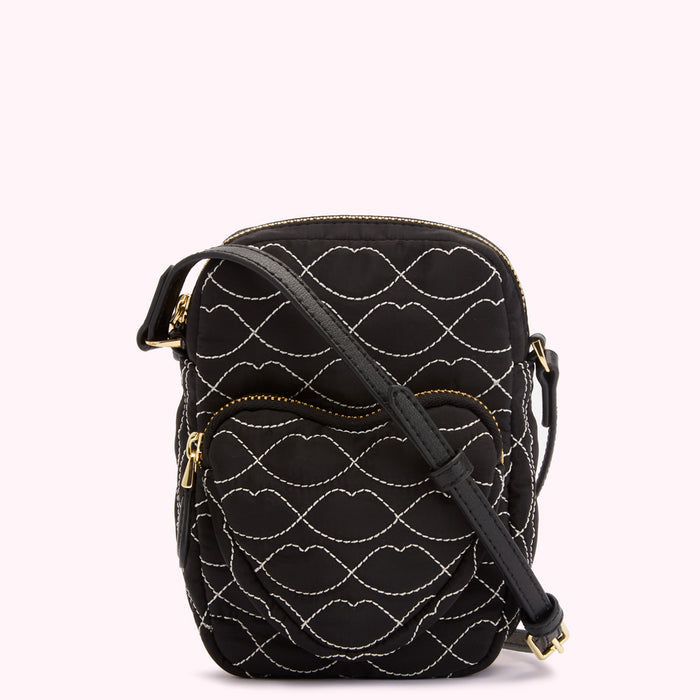 Black quilted crossbody bag with white lip pattern.