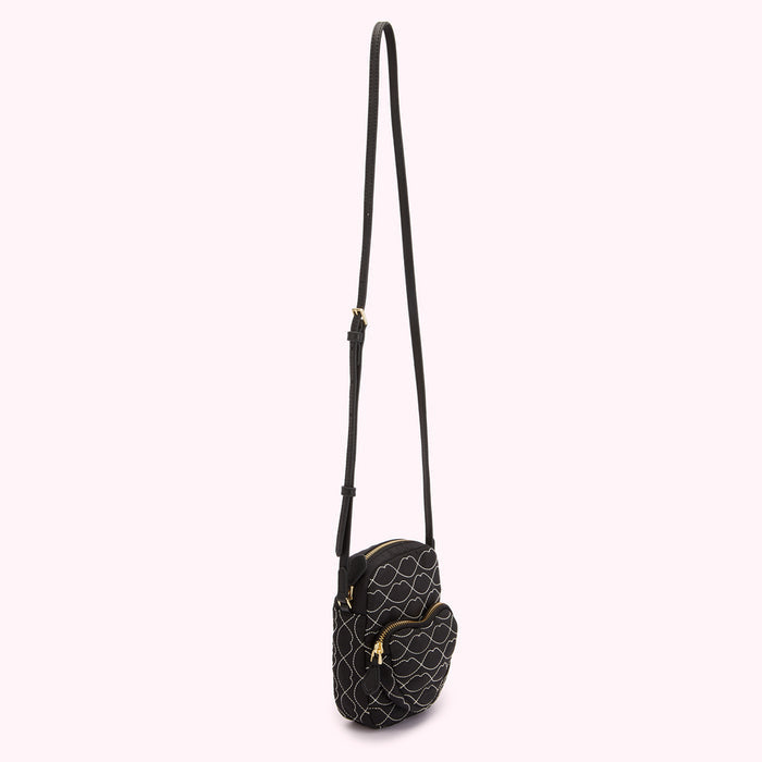 Black quilted crossbody bag with white stitching in a lip design.