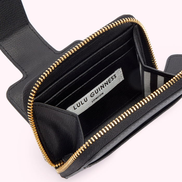 Open black Lulu Guinness zip-around wallet with gold zipper and striped interior.