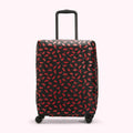 Black suitcase with red lips pattern.