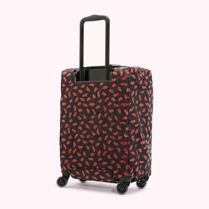 Black suitcase with a red lips pattern luggage cover.