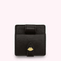 Black leatherette lip-shaped compact mirror with gold clasp.
