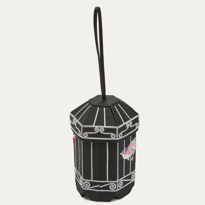 Black octagonal box with silver detailing and embroidered birds, hanging from a black cord.