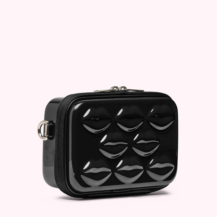 Black crossbody bag with glossy lip design.