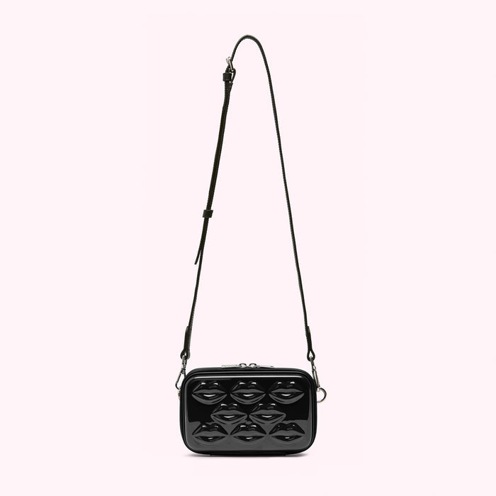 Black crossbody bag with a lip-shaped pattern.
