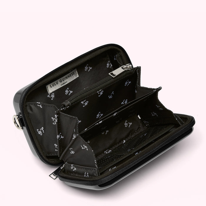 Open black Lulu Guinness crossbody bag showing interior details and compartments.
