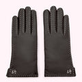 Pair of black leather gloves with white stitching and embroidered logo on a white background.