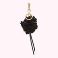Black and gold pom-pom keychain.