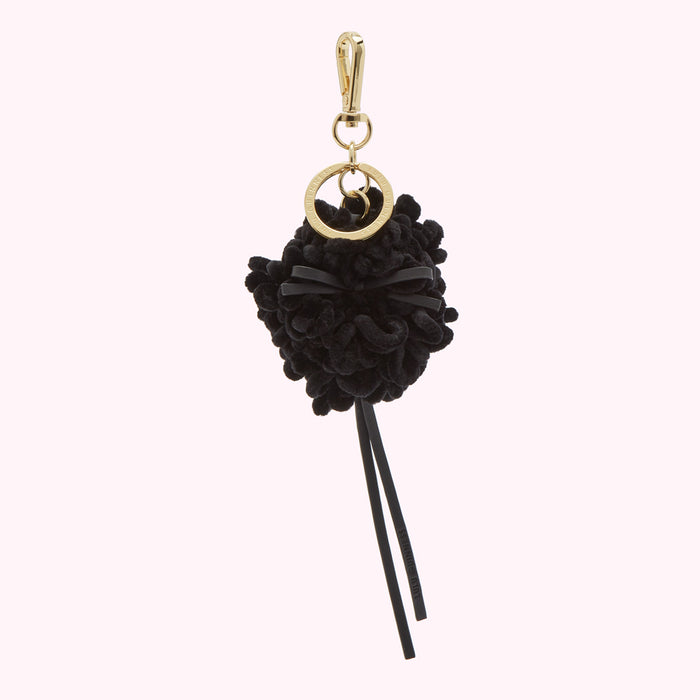 Black and gold pom-pom keychain.