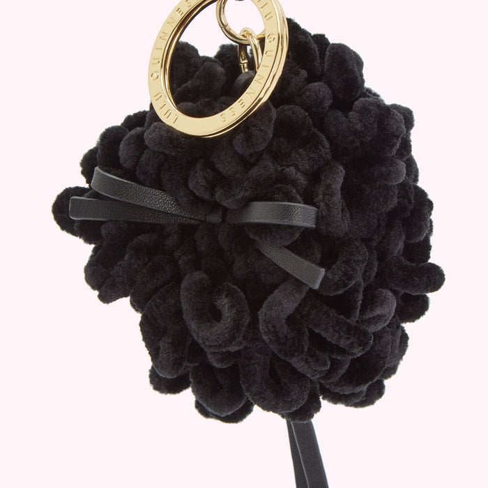 Black velvet pom-pom keyring with gold-toned Lulu Guinness logo.