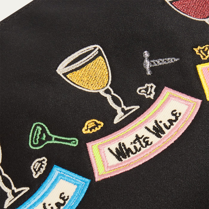 Black satin pouch with colourful embroidered wine-themed designs on a black background