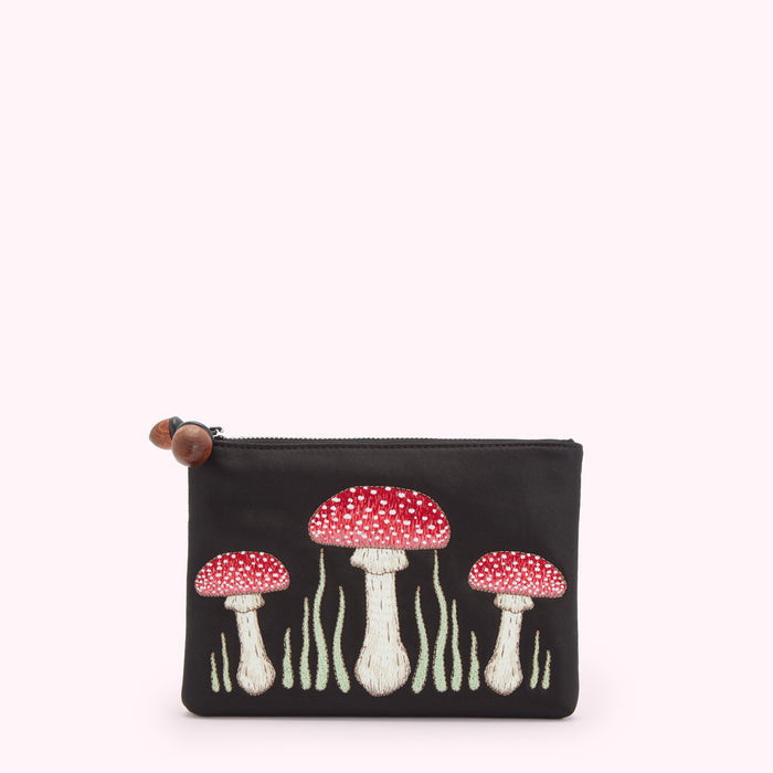 Black satin pouch with embroidered red and white mushrooms.