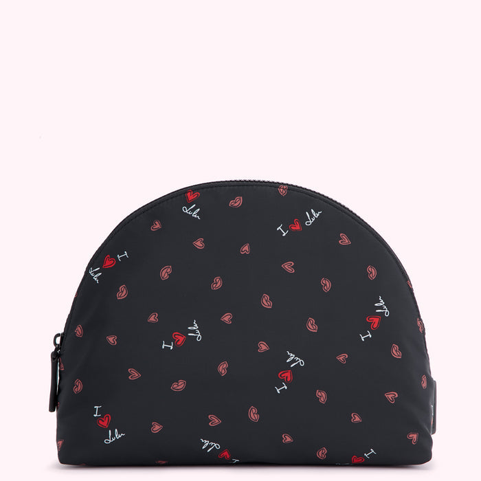 Black half-moon shaped cosmetic bag with a repeating pattern of red hearts, pink lips, and the text "I love Lulu" in white.