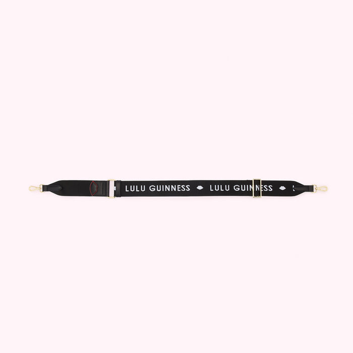 Black shoulder strap with gold clasps and the Lulu Guinness logo in white.