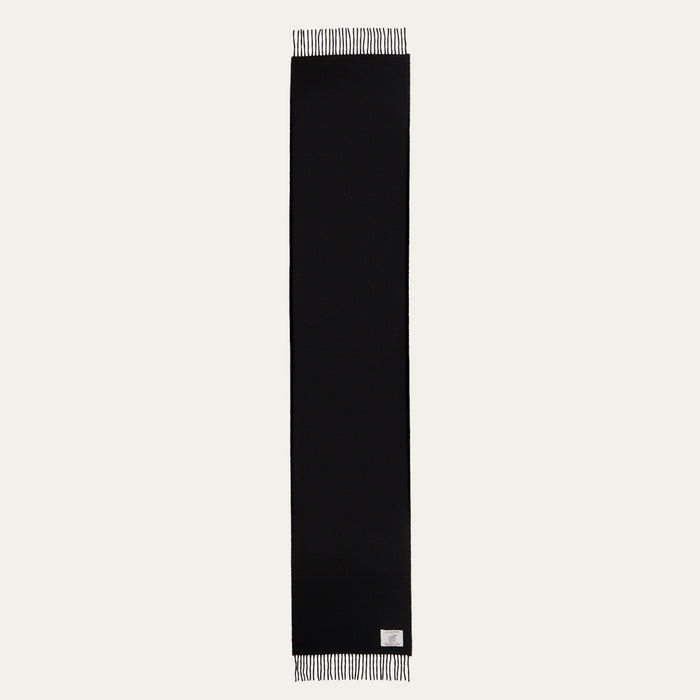 Black rectangular scarf with fringed edges and a small label.