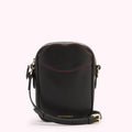 A front image of a black leather crossbody bag with gold hardware, contrasting red lip shaped stitching on the front pocket and a gold foil print 'Lulu Guinness' logo.