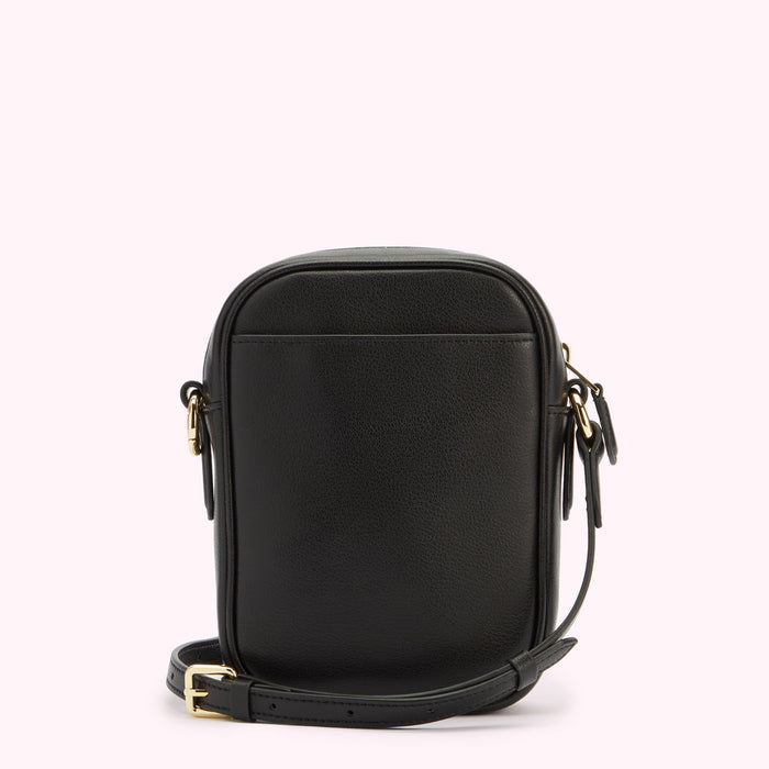 A back image of a black leather crossbody bag showing the strap folded down with gold hardware.